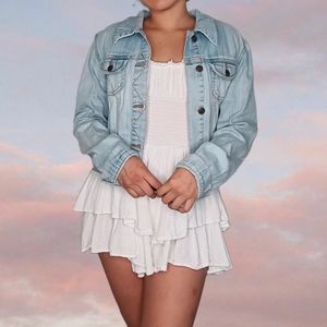 Light blue denim jacket with distressing